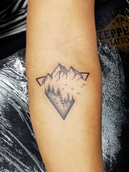 This geometric nature tattoo combines mountains, trees, and birds within a diamond frame. I will teach you how to blend dotwork shading with clean lines to create beautiful landscape tattoos.