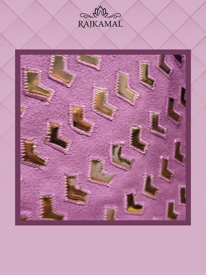 A graphic highlighting the unique geometric cut-work fabric of the purple jacket.