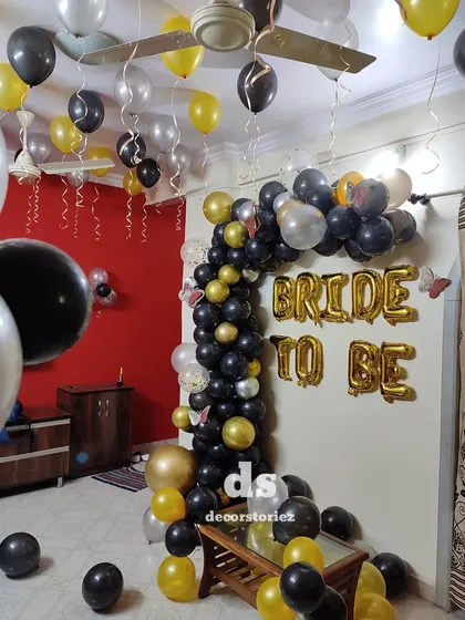 This image shows the full scale of our 'BRIDE TO BE' balloon decoration in a client's home. We filled the space with a balloon arch, ceiling balloons, and floor balloons to create an immersive party atmosphere.