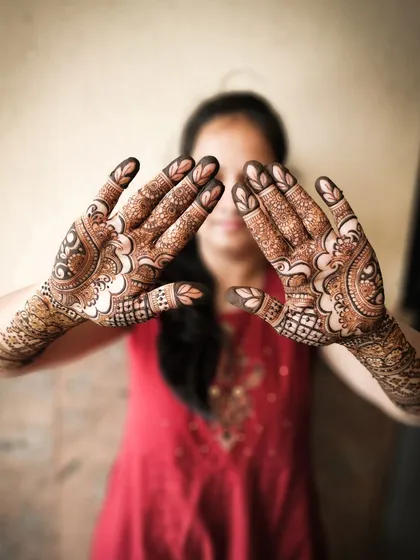 A playful pose showing off the intricate details on the back of the hands.