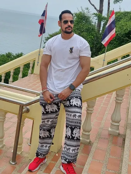 Posing on the steps in Thailand. Even on vacation, the mindset of a fit individual remains.