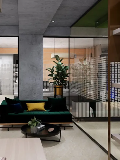 The MD cabin in our upcoming office project features a monotone palette to create an ideal working space. A comfortable green sofa provides a small, informal meeting or relaxation area within the cabin.