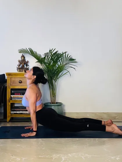 A deeper expression of Cobra Pose, or Upward-Facing Dog (Urdhva Mukha Svanasana). This pose is part of the Sun Salutation and is fantastic for strengthening the back and opening the chest.