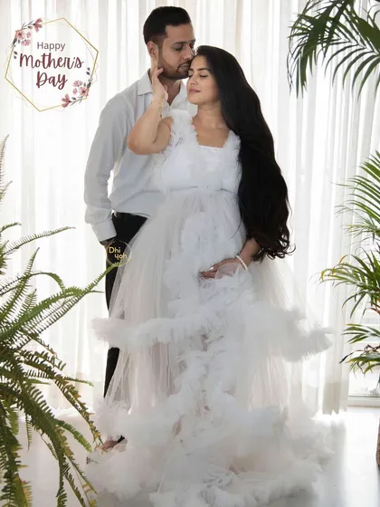 We can create a bright and modern feel in the studio by incorporating natural elements like plants. This couple's portrait feels fresh and full of life, celebrating their journey together.
