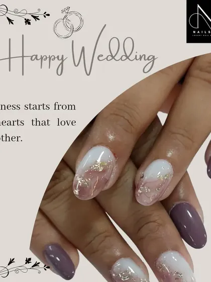 A soft and dreamy wedding nail design. We used a muted purple and a marbled white-and-gold-foil effect to create a sophisticated and unique look for the special day.