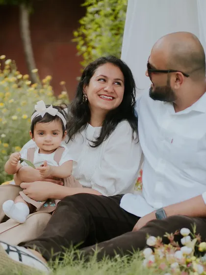 A happy family surrounded by nature. Their smiles say it all in this beautiful outdoor portrait.