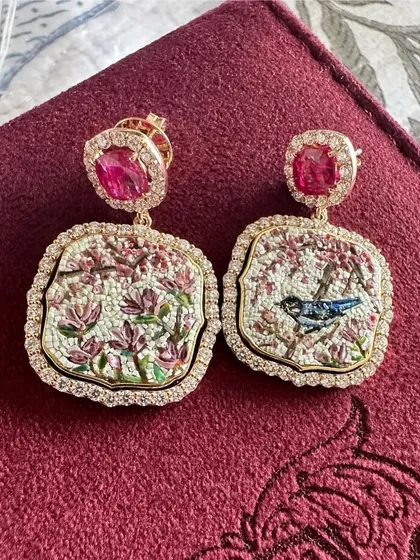 Another view of the Cherry Blossom earrings, showcasing the craftsmanship and the beautiful contrast between the bird and the flowers.