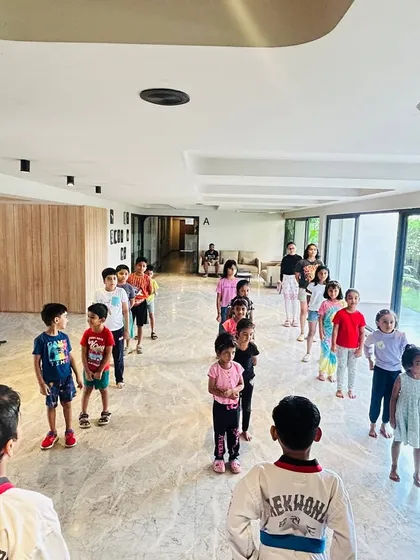 A wide shot of our class, showing students of all ages learning together.