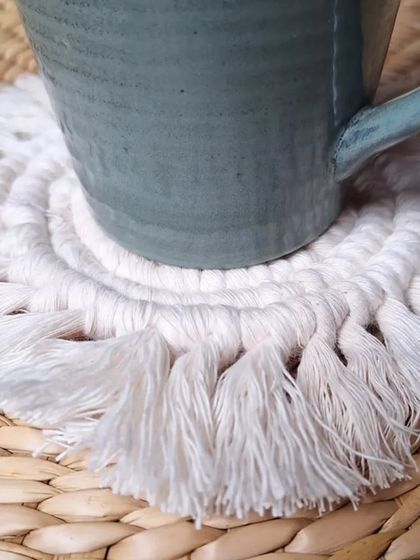 A close-up showing how the coaster protects your table while adding a touch of boho style.