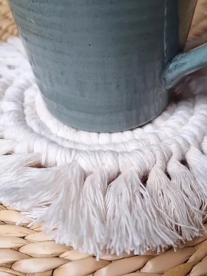 A close-up showing how the coaster protects your table while adding a touch of boho style.