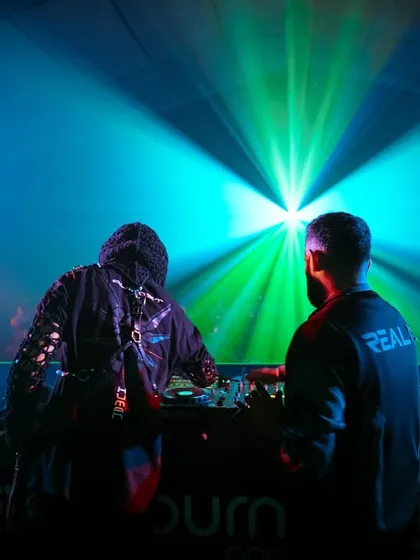 A powerful silhouette shot of me and Almost Human against the bright lights of the Sunburn festival stage.