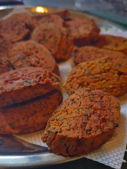 A plate of crispy, golden-brown Kothimbir Wadi, fresh out of the pan. This was one of the most popular snacks at my Maharashtrian food festival in Chennai.