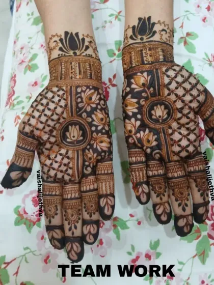 A lovely design by my team, combining lotus mandalas with intricate check patterns. It's a balanced and beautiful look for any festive occasion.