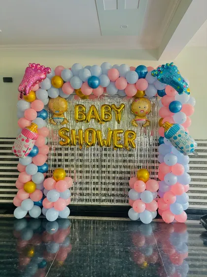 A clear, straight-on shot of the colorful baby shower photo backdrop.