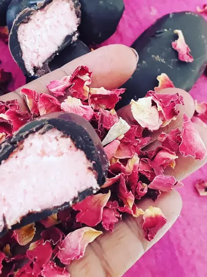 A close-up of my vegan rose-flavoured bounty bar. The creamy coconut filling and dark chocolate shell make for an irresistible combination, handcrafted with love.