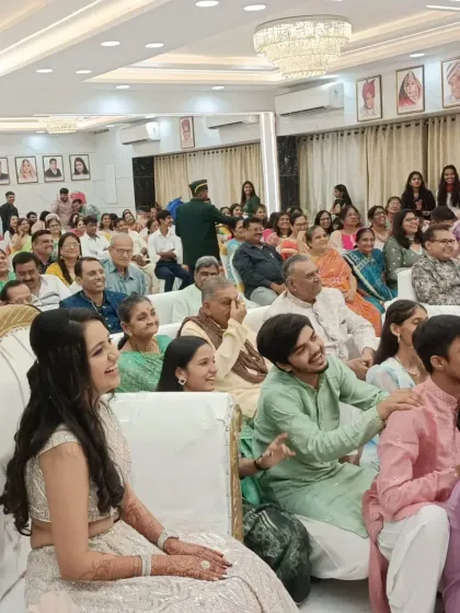 The bride and other guests enjoying the show, with smiles all around.
