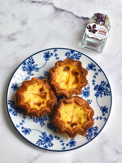 Our Saffron Pastel Custard Tarts, a Spanish take on the classic Portuguese dessert. The flaky crust and creamy, saffron-infused custard are a match made in heaven.