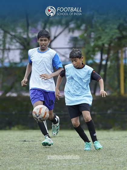 A young player shields the ball from a defender during a practice match. We simulate real-game scenarios to improve decision-making under pressure.