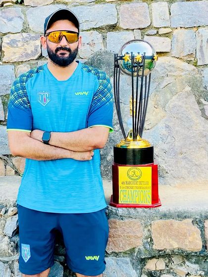 Standing proudly with the championship trophy. This is what we strive for.