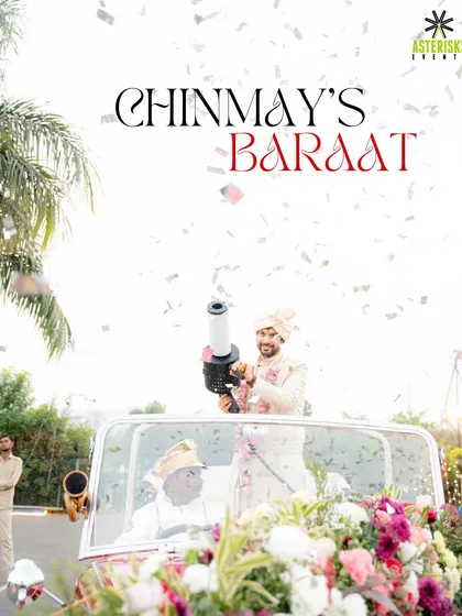 The groom's baraat is all about energy and celebration. Here, the groom makes a grand entrance in a vintage car, complete with a confetti cannon.