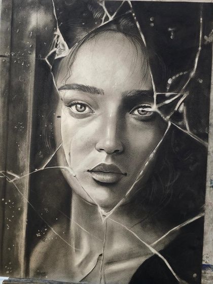 The finished artwork on the easel. This powerful charcoal portrait, depicting a face seen through shattered glass, is a brilliant example of advanced conceptual art and technical skill.
