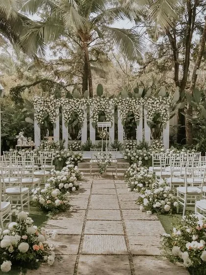 Images from beautiful Christian weddings at my venue. The stone aisle serves as a natural walkway, and the open lawn allows for classic seating arrangements, creating a picturesque chapel-in-nature feel.