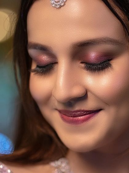 A beautiful close-up focusing on the bride's elegant eye makeup. Capturing these details showcases the artistry of the entire bridal look.