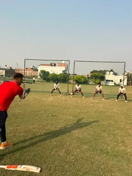 Fielding drills in progress. A sharp fielder saves runs and creates chances. We dedicate specific time to improve agility, catching, and ground fielding.