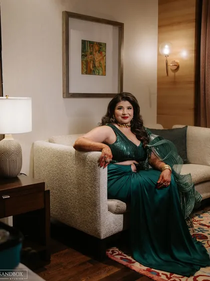 A series of portraits showcasing the bride's elegant and modern reception look, highlighting the details of her designer saree.