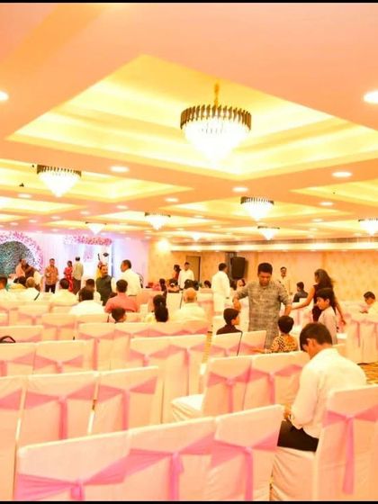 A live wedding event at Jashan banquet hall in Nerul. The hall is filled with guests, but the space still feels open and comfortable, with a clear view of the stage.