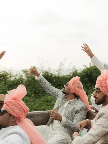 The groom's squad making a stylish entry in a vintage convertible for a Goa wedding. Baraat level: boss!