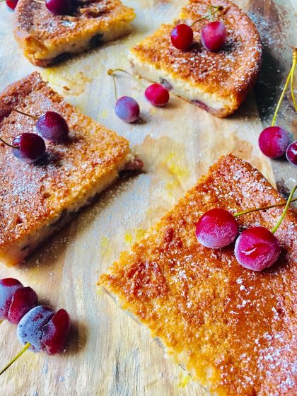 Another beautiful shot of the vegan vanilla cherry lime cake slices, dusted with a little powdered sugar.