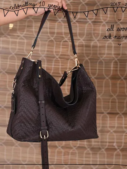 The Namrata hobo bag, fully crafted in our All Woven Oak leather. The hand-weaving process gives this large, soft bag a beautiful texture and structure while keeping it lightweight and comfortable for everyday use.