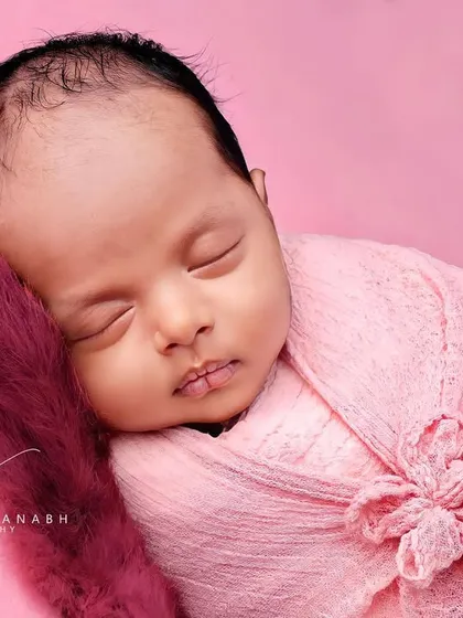 A detailed close-up of the baby's face, highlighting their perfect features.