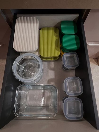 A drawer for glass containers and colorful lids. We group the lids together, making it quick and easy to find the right match.