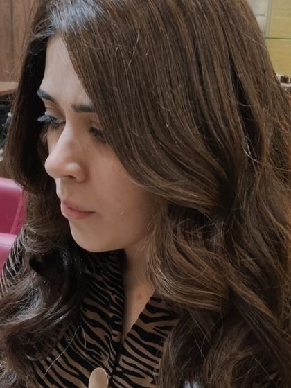 The side profile of this gorgeous hair transformation. The colour is rich and the style is soft and feminine, a perfect combination for a timeless look.