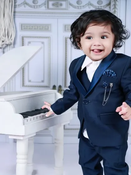 This dapper young man in a navy blue suit is a natural at the piano. Our musician theme is perfect for showcasing your child's budding talents and charm.