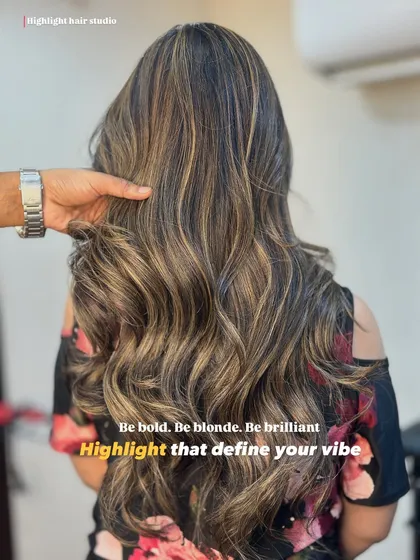 Be bold, be brilliant. We created these beautiful blonde highlights using a balayage technique for a seamless, sun-kissed effect. The soft waves really make the different tones pop.