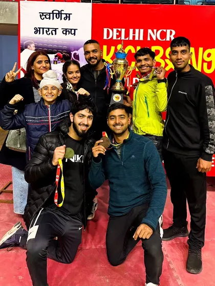 The team celebrating with our trophy at the Delhi NCR Kickboxing Cup. A fantastic achievement for everyone involved.