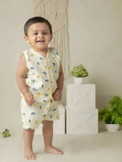 An adorable solo portrait of a little boy in our classic boho themed setup. The neutral tones and simple props keep the focus on his happy smile.