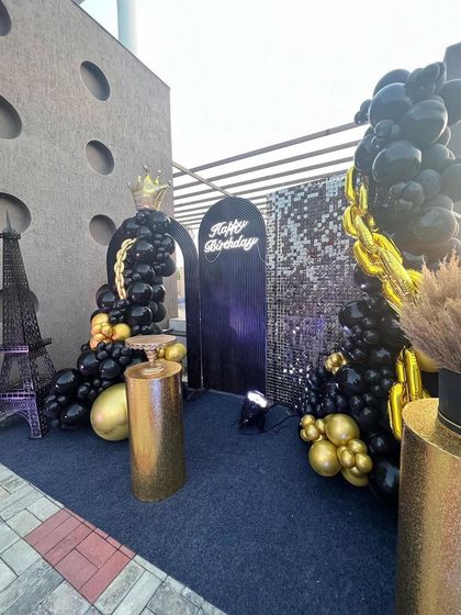 The black and gold setup from a different perspective, showing how it transforms the outdoor terrace space.