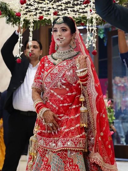 The bridal entry is such a special moment. My bride Bani looked so graceful walking under the phoolon ki chadar.