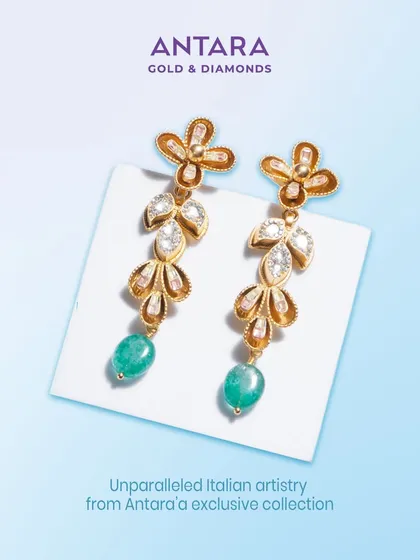 These earrings showcase unparalleled Italian artistry. The French enamel work on the gold floral motifs, combined with diamond leaves and emerald drops, is for those who recognize true craftsmanship.