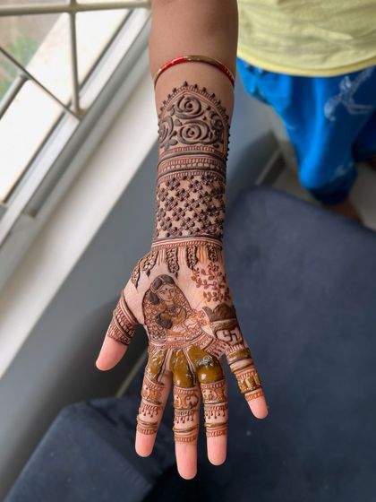 A close-up of the Savitri portrait from the Vatsavitri festival design.