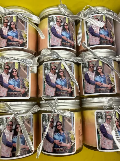 Another look at the personalized ombre candles for a 25th anniversary celebration. The photo label makes it a truly unique and memorable keepsake for guests.