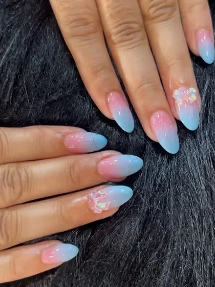 A soft and dreamy pink and blue ombre, like a cotton candy sky, with delicate 3D clear flower accents.