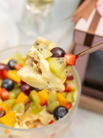 A spoonful of my summer Napoleon, which is an upgrade on the classic with the addition of fresh fruits like kiwi, grapes, and strawberries.