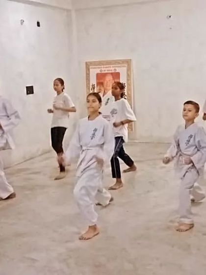 Students practicing their forward movement in stance. Footwork is just as important as hand techniques.
