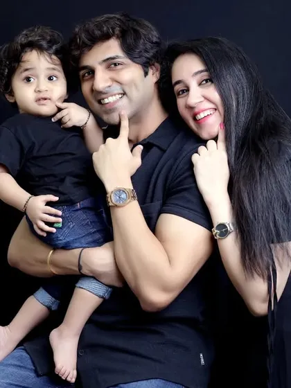 A fun and engaging family studio portrait with a toddler. We create a comfortable environment where even the little ones can express their personality, resulting in genuine smiles and happy memories.