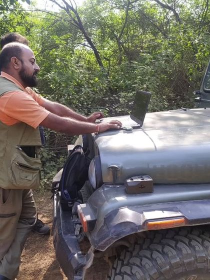 Back at the jeep, we transfer data from our camera traps. Technology plays a huge role in our non-invasive documentation of wildlife.